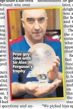  ??  ?? Prize guy: John with Sir Alex Ferguson’s trophy