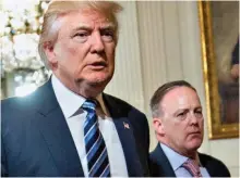  ??  ?? Tumultuous tenure: Sean Spicer with Donald Trump