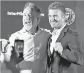  ?? CHARLES TRAINOR JR./AP ?? Jorge Mas, left, and David Beckham are among the investors with Miami’s MLS expansion team.