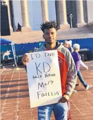  ?? COURTESY OF MICHAEL STINNETT ?? High school student Xavier Turner holds a sign Tuesday during teacher protests outside the Oklahoma state Capitol in Oklahoma City, Okla.