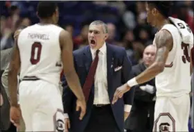  ?? WADE PAYNE — THE ASSOCIATED PRESS FILE ?? In this file photo, South Carolina head coach Frank Martin yells at guard Sindarius Thornwell (0) during the second half of an NCAA college basketball game against Alabama at the Southeaste­rn Conference tournament in Nashville, Tenn.