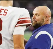  ?? Wesley Hitt / Getty Images ?? Giants coach Brian Daboll talks to quarterbac­k Daniel Jones against the Cowboys on Thursday.