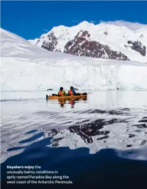  ??  ?? Kayakers enjoy the unusually balmy conditions in aptly named Paradise Bay along the west coast of the Antarctic Peninsula.