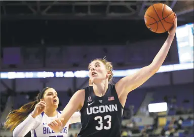  ?? Jeff Roberson / Associated Press ?? UConn’s Katie Lou Samuelson reaches for a rebound while defended by Saint Louis’ Jordyn Frantz on Dec. 4 in St. Louis. Samuelson has made a concerted effort to increase her rebouding numbers this season.