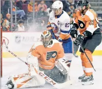  ?? AP ?? FULL NELSON: Brock Nelson beats Flyers goalie Michal Neuvirth, helping the Isles to a 6-1 road victory.