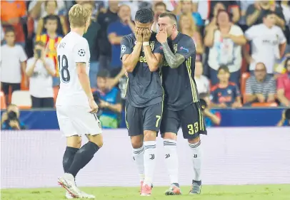  ?? Picture: AFP ?? TEARY EYES. Juventus’ forward Cristiano Ronaldo (C) reacts after receiving a red card during the Uefa Champions League group H match against Valencia FC at the Mestalla Stadium in Valencia last night.