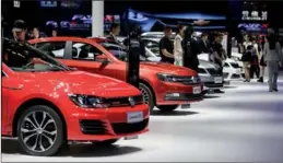  ?? XINHUA ?? The world’s largest automakers attended the 2017 Shanghai Auto Show, which opened on April 19, where they announced plans for new electric vehicles in China. The Chinese government is considerin­g a new policy that 8 percent of high-volume automakers’ vehicle sales be new-energy models by 2018.