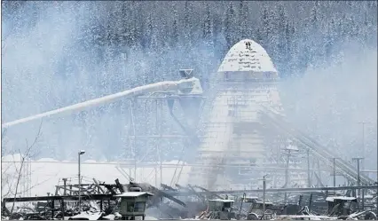  ?? — DAVE MILNE FILE PHOTO ?? Babine Forest Products mill in Burns Lake smoulders after fatal explosion and fire.