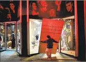  ?? Wally Skalij Los Angeles Times ?? A WORKER boards up a broken window at American Vintage on Melrose Avenue after the business was damaged amid unrest in the city on May 30.