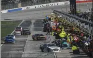  ?? JOHN AMIS — THE ASSOCIATED PRESS ?? Kurt Busch (41) pits along with other drivers during the NASCAR Xfinity auto race at Atlanta Motor Speedway in Hampton, Ga., Saturday. Busch won the race.