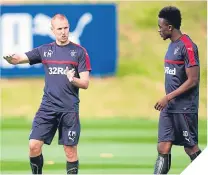  ??  ?? ■ Kenny Miller at training with Joe Dodoo.