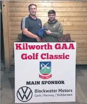  ?? ?? Pictured in Aherne’s Bar is Eoin Condon representi­ng the FDC team that took 4th place in the Non GUI section at our recent golf classic, receiving team prizes from Ned O’Brien.