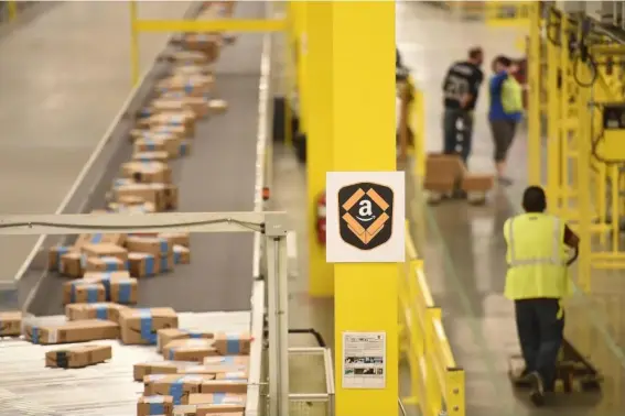  ??  ?? Ambulances have been called to Amazon warehouses for overworked staff (Reuters)