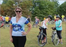  ?? PHOTO BY MICHILEA PATTERSON – FOR MEDIANEWS GROUP ?? A woman wears a SRT Ale cycling jersey during the 2019 Ride for the River event.
