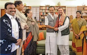  ?? — PTI ?? DMK president M. K. Stalin with Congress president Rahul Gandhi pose for photos as DMK leaders arrive at the residence of former Congress president Sonia Gandhi to wish her on her birthday in New Delhi on Sunday.