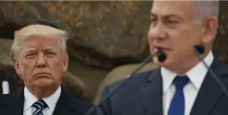  ?? EVAN VUCCI/THE ASSOCIATED PRESS FILE PHOTO ?? President Donald Trump listens as Israeli Prime Minister Benjamin Netanyahu speaks in Jerusalem earlier this year.