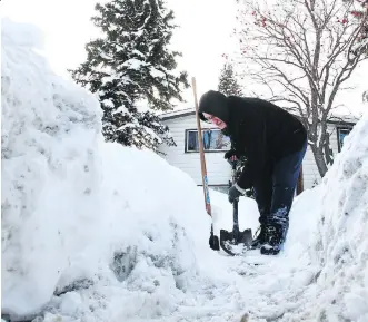  ?? JIM WELLS ?? Neal Sanch shovels snow and ice from the front of his northwest Calgary house back in February. Next winter, homeowners who don’t clear their sidewalks promptly could be looking at steep fines.