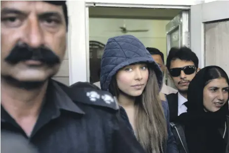  ?? AP ?? Pakistani model Ayyan Ali leaves court in 2015. She is accused of smuggling $500,000 in undeclared cash from Islamabad