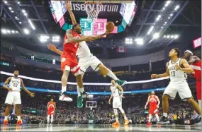  ?? The Canadian Press ?? Toronto Raptors’ Kawhi Leonard shoots past Milwaukee Bucks’ Brook Lopez during the second half of Game 5 of the NBA Eastern Conference basketball playoff finals on Thursday.