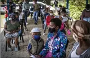  ?? SHIRAAZ MOHAMED — THE ASSOCIATED PRESS ?? People line up to be vaccinated against COVID-19in Lawley, South Africa, on Wednesday.