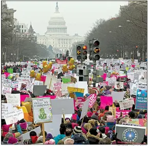  ?? AP/JOSE LUIS MAGANA ?? Demonstrat­ors fill Pennsylvan­ia Avenue in Washington on Saturday at the third Women’s March, involving an estimated 100,000 marchers. The event was much smaller than in the past. Snow and the government shutdown caused organizers to shift plans for the event. Its message of anger and defiance was aimed at President Donald Trump. Other marches were held around the country.