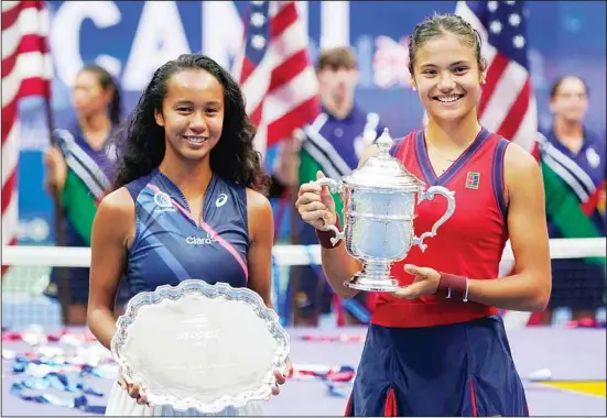  ??  ?? Leylah Fernandez of Canada (left), and Emma Raducanu of Britain, pose for photos after Raducanu defeated Fernandez in the women’s singles final of the US Open tennis championsh­ips in New York. (AP)