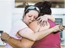  ??  ?? Two women comfort each other after Sunday’s shooting in southern Texas.