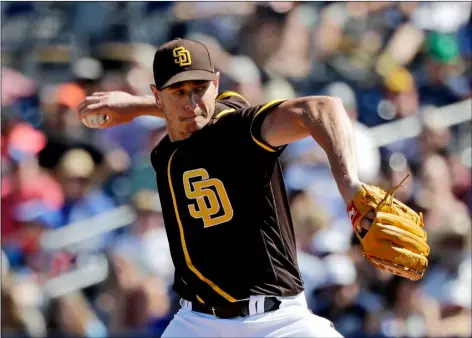  ?? AP Photo/Elaine Thompson ?? San Diego Padres starting pitcher Garrett Richards throws against the Los Angeles Dodgers during a spring training baseball game in Peoria, Ariz., in this March 9, 2020, file photo.