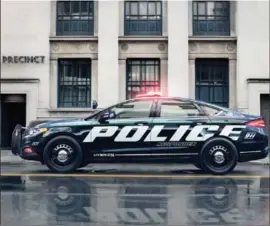  ??  ?? Ford has successful­ly completed testing of new police vehicles including the 2019 Responder Hybrid Fusion Sedan (shown).