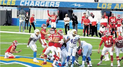  ?? Keith Birmingham, The Orange County Register ?? The Chiefs’ Harrison Butker kicks the winning field goal in overtime Sunday at SoFi Stadium in Inglewood, Calif.