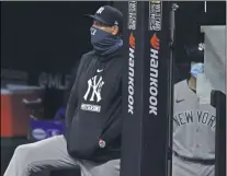 ?? DAVID DERMER - THE ASSOCIATED PRESS ?? In this Tuesday, Sept. 29, 2020, file photo, New York Yankees manager Aaron Boone watches from the dugout in the sixth inning of Game 1of an American League wild-card baseball series against the Cleveland Indians in Cleveland.