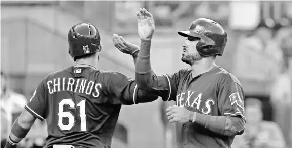  ?? NOAH K. MURRAY, USA TODAY SPORTS ?? Rangers center fielder Ian Desmond, right, is eighth in total bases in the American League with 188.