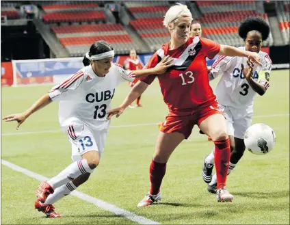  ?? JASON PAYNE/ PNG ?? Canada women’s national soccer team’s Sophie Schmidt ( centre) fights for the ball against Cuba’s Maria Isabel Perez Torres ( left) and Yutmila Galindo Rodriguez during Saturday’s CONCACAF Women’s Olympic qualifying soccer match at BC Place Stadium in...