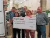  ??  ?? Online grocer Peapod presented a check to the Coventry Food Bank Feb. 20 during a grand opening of Peapod’s newest wareroom in partnershi­p with Giant Food Stores.