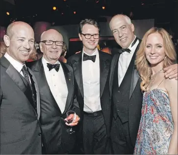  ?? Todd Williamson WireImage ?? PETER RICE, center, the newly named chairman of Walt Disney Television and co-chair of Disney Media Networks, with Howard Gordon, left, Rupert Murdoch, Gary Newman and Dana Walden in 2012.