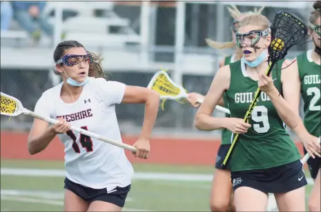  ?? Dave Phillips / For Hearst Connecticu­t Media ?? Guilford’s Lorelei King, right, is defended by Cheshire’s Ava Matikowski on Friday.