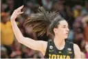  ?? DARRON CUMMINGS/AP ?? Iowa’s Caitlin Clark reacts after making a 3-pointer during the second half of a Final Four game against South Carolina on March, 31, 2023, in Dallas.