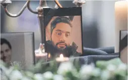  ?? THE CANADIAN PRESS ?? A picture of Mohammad Amin Jebelli stands among photos of victims of the Iranian air crash at a Toronto vigil this week. He was a master’s student at U of T.