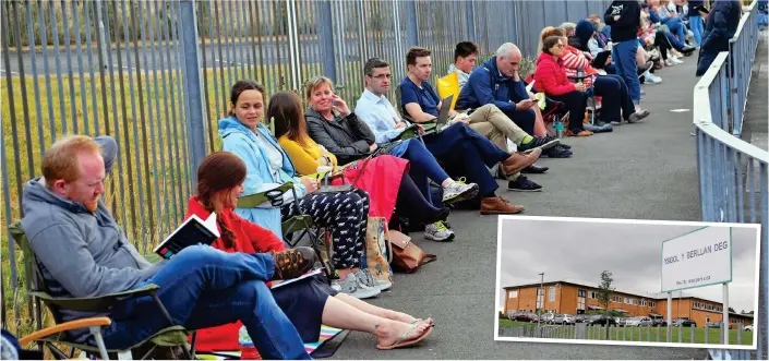  ??  ?? No pushing in: Parents sit in an orderly queue, hoping to get a coveted place at the school club