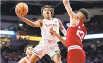  ?? ZACH BLAND/MARYLAND TERRAPINS ?? Maryland’s Fatts Russell (4) drives against Indiana’s Trayce Jackson-Davis during a game at the Xfinity Center in College Park on Saturday, Jan. 29, 2022. Russell, who scored 12 points, exited the game around the fourminute mark of the second half with an apparent hand injury that required an ice bag.