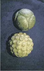  ??  ?? 0 The Towie Stone is considered Scotland’s greatest carved stone ball (top), the Sheriffmui­r Stone (right) and two balls on show at The Hunterian in Glasgow.