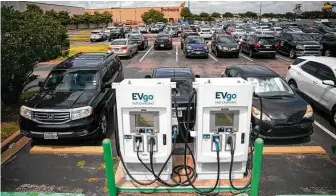  ?? Annie Mulligan / Contributo­r ?? President Joe Biden, who ran for office promising to tackle climate change, is proposing to spend $7.5 billion to expand the nation’s EV charging network, particular­ly in low-income and rural areas.