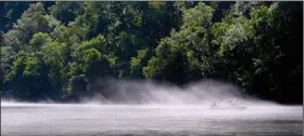  ??  ?? The cool waters of the White River offer comfortabl­e respite from summer’s heat, as well as excellent trout fishing, making it an excellent destinatio­n for an Arkansas fishing vacation. (Arkansas Democrat-Gazette/Bryan Hendricks)