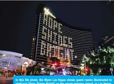  ??  ?? In this file photo, the Wynn Las Vegas shows guest rooms illuminate­d to spell out “Hope Shines Bright” as the resort remains closed, in Las Vegas, Nevada. —AFP