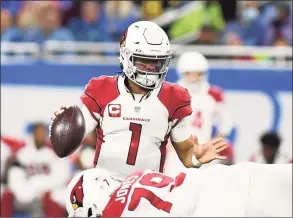  ?? Lon Horwedel / Associated Press ?? Arizona Cardinals quarterbac­k Kyler Murray scrambles during the first half against the Detroit Lions on Sunday.