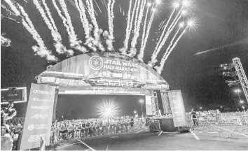  ?? AUNESTY REIKOFSKI/CORRESPOND­ENT ?? More than 15,000 runners competed in the third annual Disney Star Wars Half Marathon — The Dark Side on Sunday.