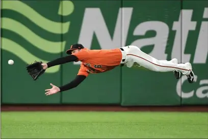  ?? DOUG DURAN — BAY AREA NEWS GROUP, FILE ?? Giants outfielder Steven Duggar makes a diving catch getting Diamondbac­ks batter Robbie Ray out of their May 2019 game in San Francisco.