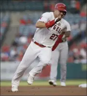  ?? ALEX GALLARDO - THE ASSOCIATED PRESS ?? FILE - In this July 30, 2019, file photo, Los Angeles Angels’ Mike Trout rounds second to advance to third from first on a single by Shohei Ohtani against the Detroit Tigers during the first inning of a baseball game in Anaheim, Calif.