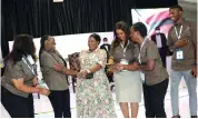  ?? ?? Environmen­t and Tourism patron First Lady Dr Auxillia Mnangagwa share a lighter moment with members of the Zambian delegation after handing them their award at the Sanganai/ Hlanganani World Tourism Expo during the official opening in Bulawayo on Friday