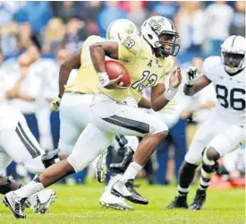  ?? JACOB LANGSTON/STAFF PHOTOGRAPH­ER ?? UCF quarterbac­k Justin Holman earned the starting job by leading the Knights’ rally against Penn State in Ireland. Now coaches are asking Holman to be a more vocal leader.